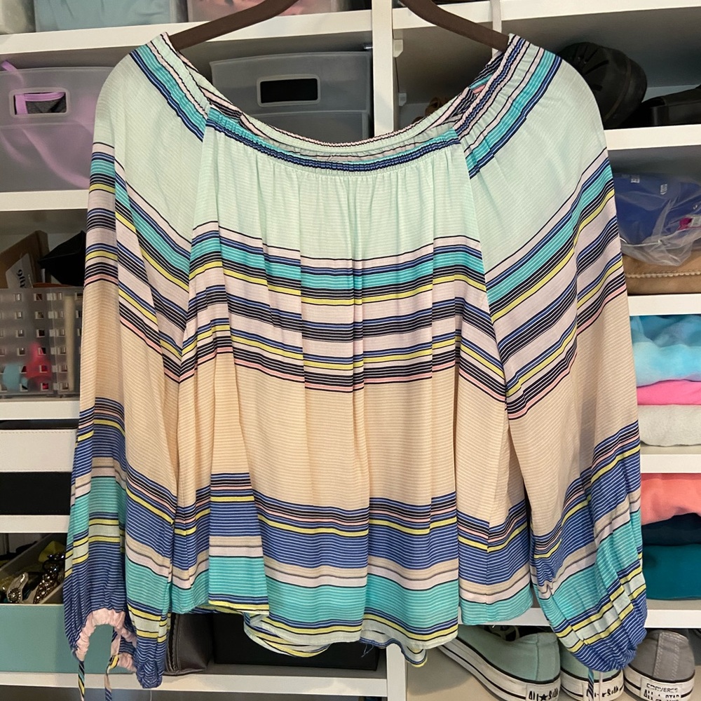 Striped blouse can be worn on or off shoulder
